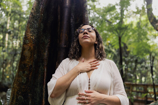 Woman connecting with intention in nature