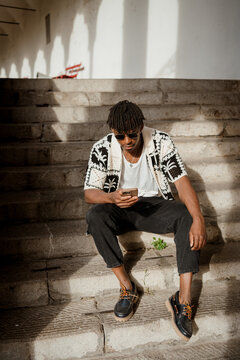 A man uses a mobile phone in the city