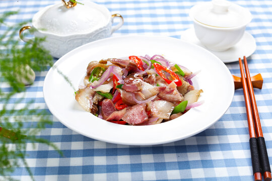 Stir Fried Pork with Red Onion and Chili in White Bowl