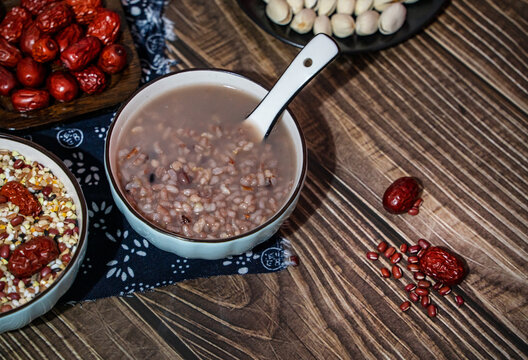Traditional Chinese Laba Congee with Mixed Grains and Red Dates on Rustic Table