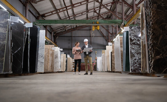 Male and Female Adult workers in marble warehouse