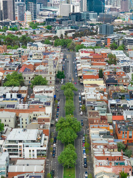 Tree lined streets and high rise buildings of an inner city suburb