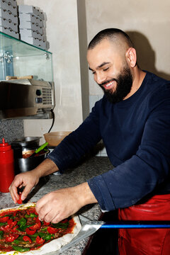 Smiling pizza chef
