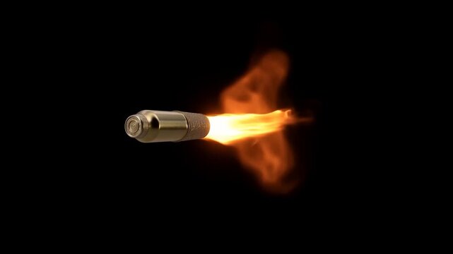 Tracking shot of fired bullet flying with fiery muzzle flash and flame trail against black background in studio close up