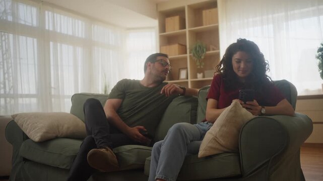 Upset angry couple arguing quarrel phone addicted jealous sms woman argument family problem Caucasian man guy male boyfriend husband argue offended Hispanic girl female girlfriend wife home conflic