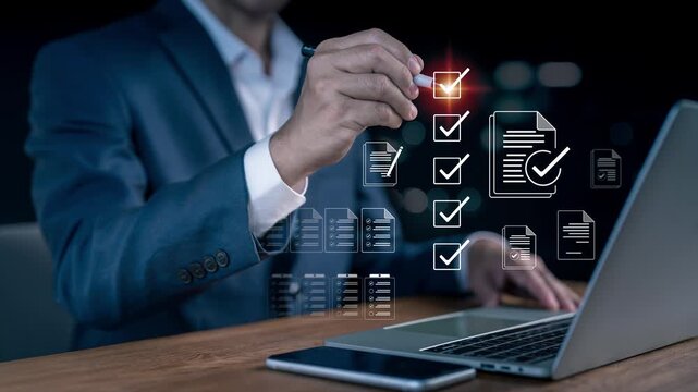 Businessman holding a pen to check virtual digital document icons with checkmarks on a laptop, managing corporate checklist compliance, quality assurance, survey audit, and task execution concept.
