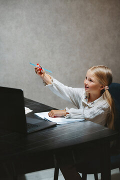 Child girl studying in online school edtech platform using laptop homeschooling digital education class, kid showing project and learning course with remote teacher selfstudy modern technology
