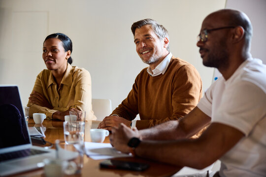 Cheerful colleagues gathered in a meeting