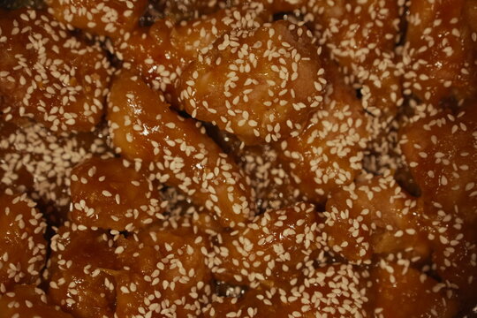 Golden Brown Sticky Glazed Fried Chicken Wings with Sesame Seeds Overhead View for Fast Food Concept