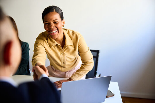 Woman greets her business partner