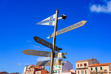 Fototapeta premium Decorative wind direction sign post in La Maddalena, capital city of the eponym archipelago located in the Mediterranean Sea in north-east of Sardinia, Italy