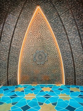 Detail beauty of Islamic geometric ornaments with star patterns in the dome architecture interior of Al-Jabbar Grand Mosque.