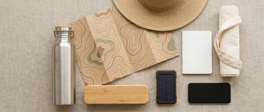 Sustainable travel essentials arranged in a clean flat lay