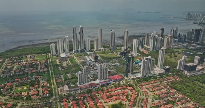 Panama City Aerial v82 flyover costa del este residential neighborhood outskirt suburb of central district with mixed of high rise towers and gated community - Shot with Mavic 3 Cine - March 2022