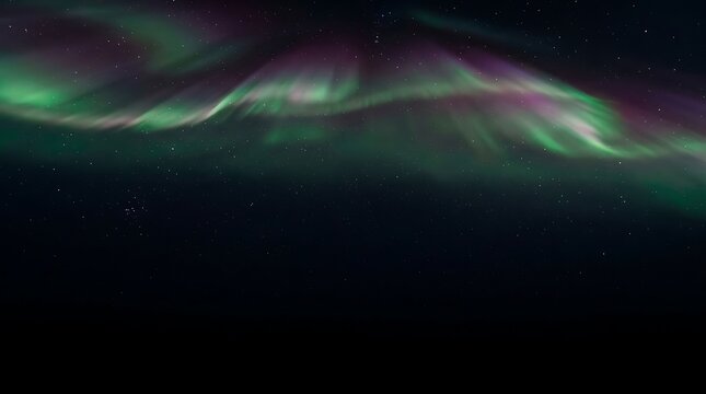 Northern lights dance across a dark starry night sky with vibrant green and purple aurora borealis curtains illuminating the atmospheric darkness.