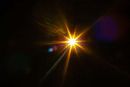 Sun flare on the black background