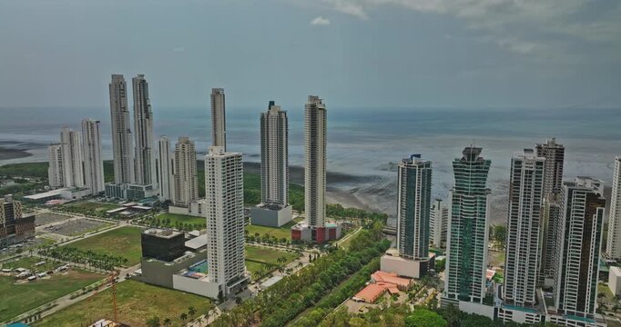 Panama City Aerial v84 panoramic view drone flyover costa del este neighborhood capturing waterfront condominium complex and residential communities housing areas - Shot with Mavic 3 Cine - March 2022