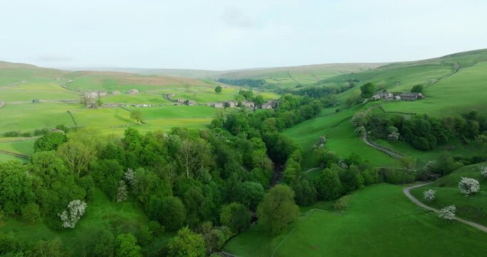 Flying over a river and forest in Swaledale