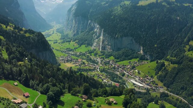 Aerial Drone View of Lauterbrunnen Valley, Switzerland with Waterfalls and Green Alpine Village
