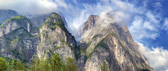 Obraz premium beautiful rocky peak mountains in clouds in italian Dolomites
