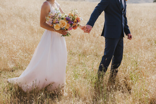 Bride and Groom in a Field