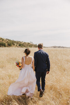 Bride and Groom in a Field