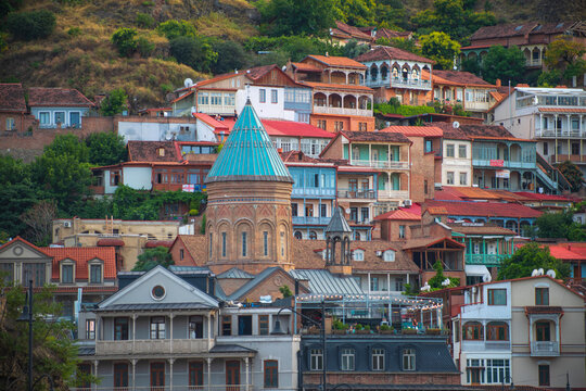  Panoramic Surb Gevorg Armenian church in Old Tbilisi with traditional houses and copy space