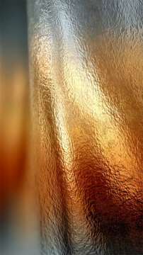 Abstract textured metallic surface with gold and silver gradient