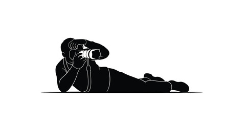 Lying photographer with camera black silhouette against a white background silhouette photography camera lens shooting capture image portrait prone reclining © Moriom