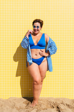 Beautiful plus size woman with swimwear at the beach