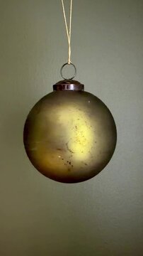 4K Seamless Loop Video of Green Glass Christmas Tree Ball Ornament Decoration