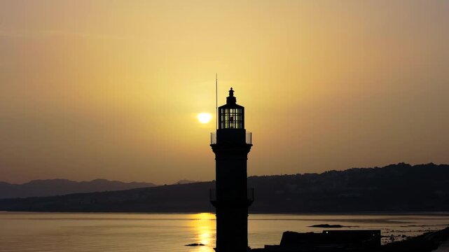  View of Chania with the amazing lighthouse, mosque, venetian shipyards, Crete, Greece.Waves crashing on lighthouse, Beautiful Greece and best scenic places - panorama
