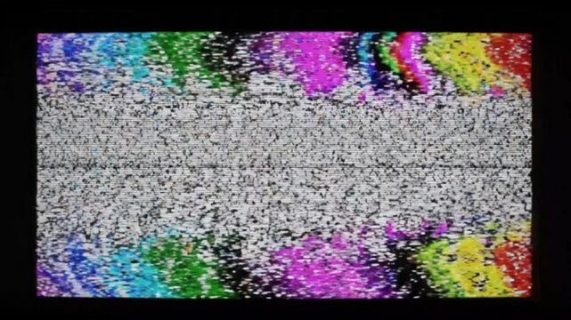 Static Noise on Television Screen: A visual representation of television static, with colorful bands and a gray, noisy screen, suggesting a loss of signal or broadcast interruption.