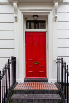 Typical red front door of a Victorian terraced house in London