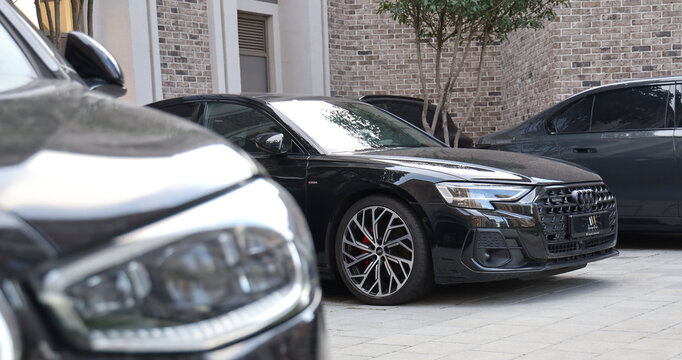 Belgrade, Serbia - July 4, 2025: cars standing in a row. Fleet of generic modern autos Transportation Luxury vehicle fleet consisting of Audi quattro s1 BMW Mercedes Benz brands automobile background
