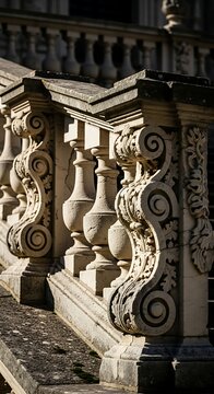 Ornate stone balcony with intricate carvings and balusters