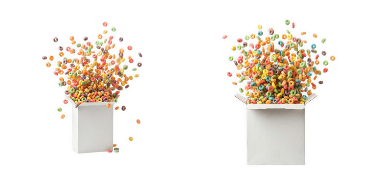 Colorful fruit flavored cereal rings exploding from white boxes isolated on transparent background