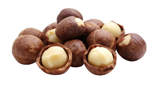 A group of macadamia nuts, some whole and some cracked open to reveal creamy white kernels, isolated on a black background