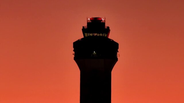 airport control tower at sunset
