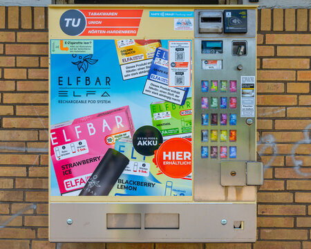 Wolfsburg, Germany - 08 July 2026: Elfbar vending machine on brick wall selling disposable e-cigarettes and vape products in Wolfsburg