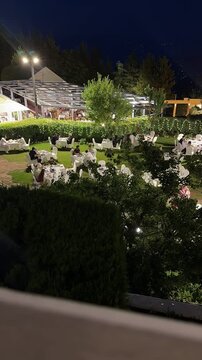 A timelapse footage of people in an open air restaurant. DInner buffet. 