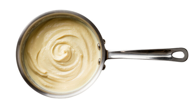 Isolated metal saucepan with creamy light yellow sauce or custard swirled inside, top view