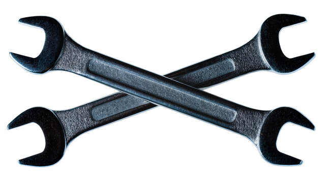 Isolated two crossed metal open-end wrenches, industrial hand tools for repair and maintenance