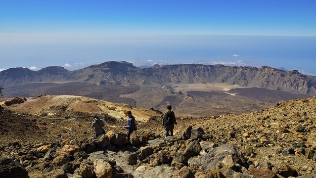 Pico del Teide, summit of Mount Teide, Three people enjoying spectacular views of the mountains, Teide National Park, Teide National Park, volcano, volcanism, UNESCO World Heritage Site, Tenerife, Canary Islands, Spain