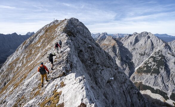 Mountain panorama, group of mountaineers on the ridge of the Gamsjoch, transition to the main summit of the Gamsjoch, western summit with summit cross behind, in autumn, Ri&szlig;tal in the Eng, Karwendel, Tyrol, Austria