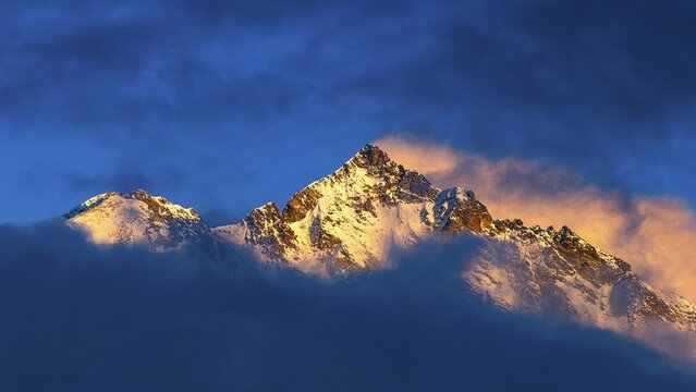 Snow-covered summit of the Weisshorn mountain, illuminated by the evening sun, view from Grimentz, Val d'Anniviers, Valais Alps, Canton Valais, Switzerland