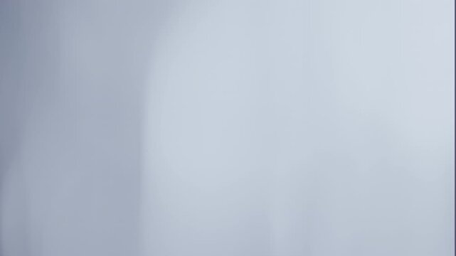 Abstract motion gradient metallic grey white background.
