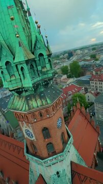 Agile flight around St. Joseph's Church and over Podgorski Square in Cracow
