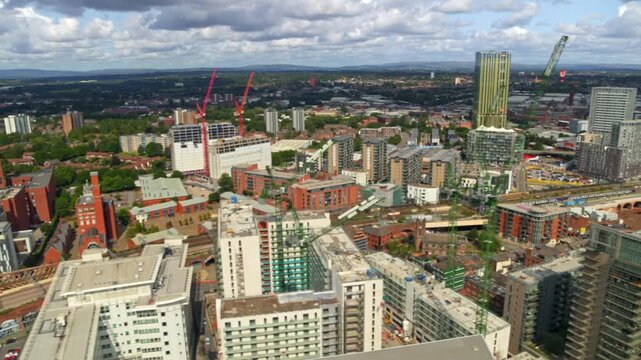 Aerial view from above a modern city with ongoing construction and building development