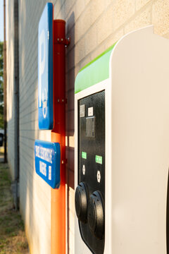 Hasselt, Belgium. Electric vehicle charging station beside dedicated EV parking sign at university campus
